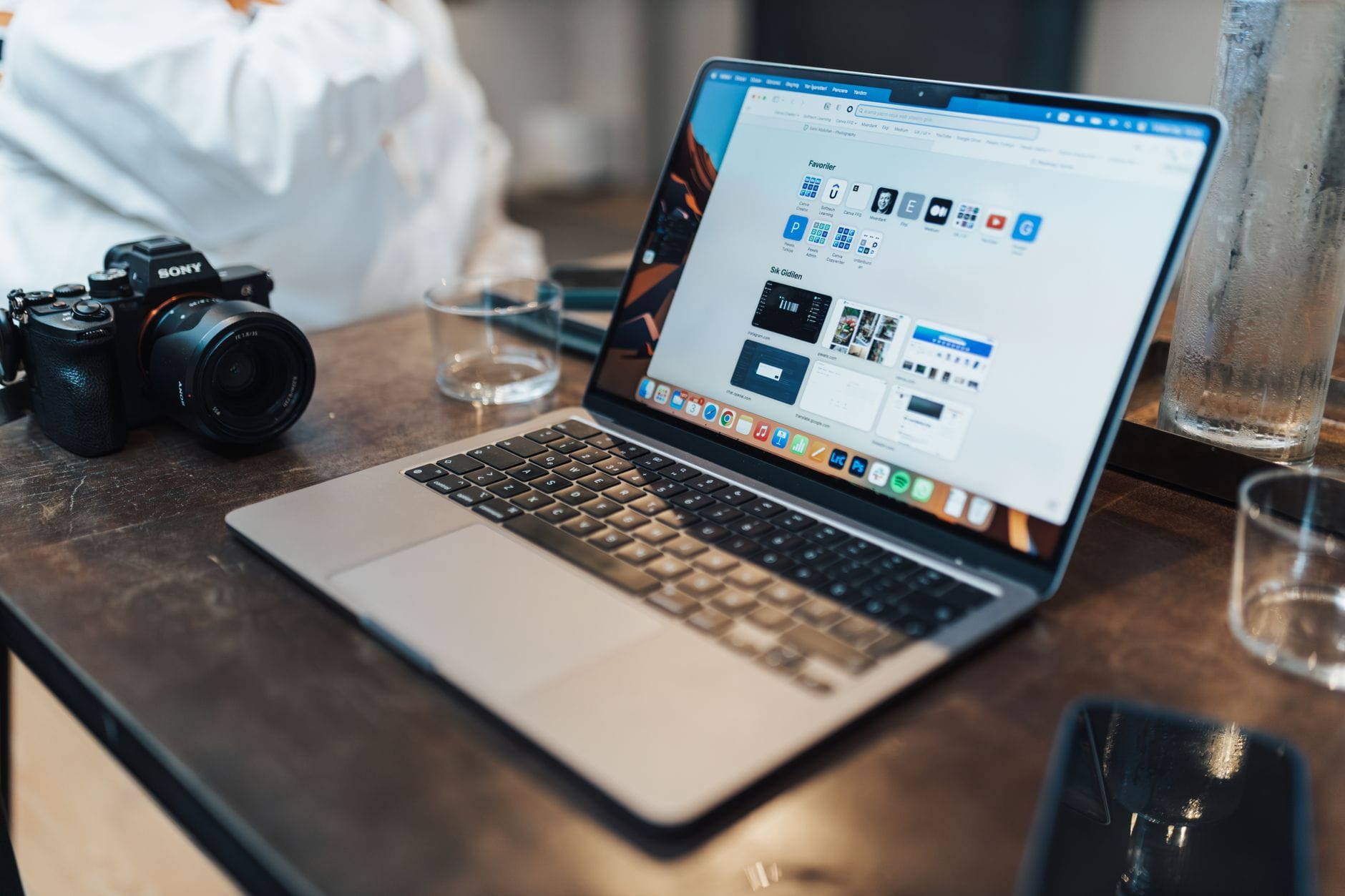 A laptop and tech workspace, evoking media encode and inference now running client-side in the browser